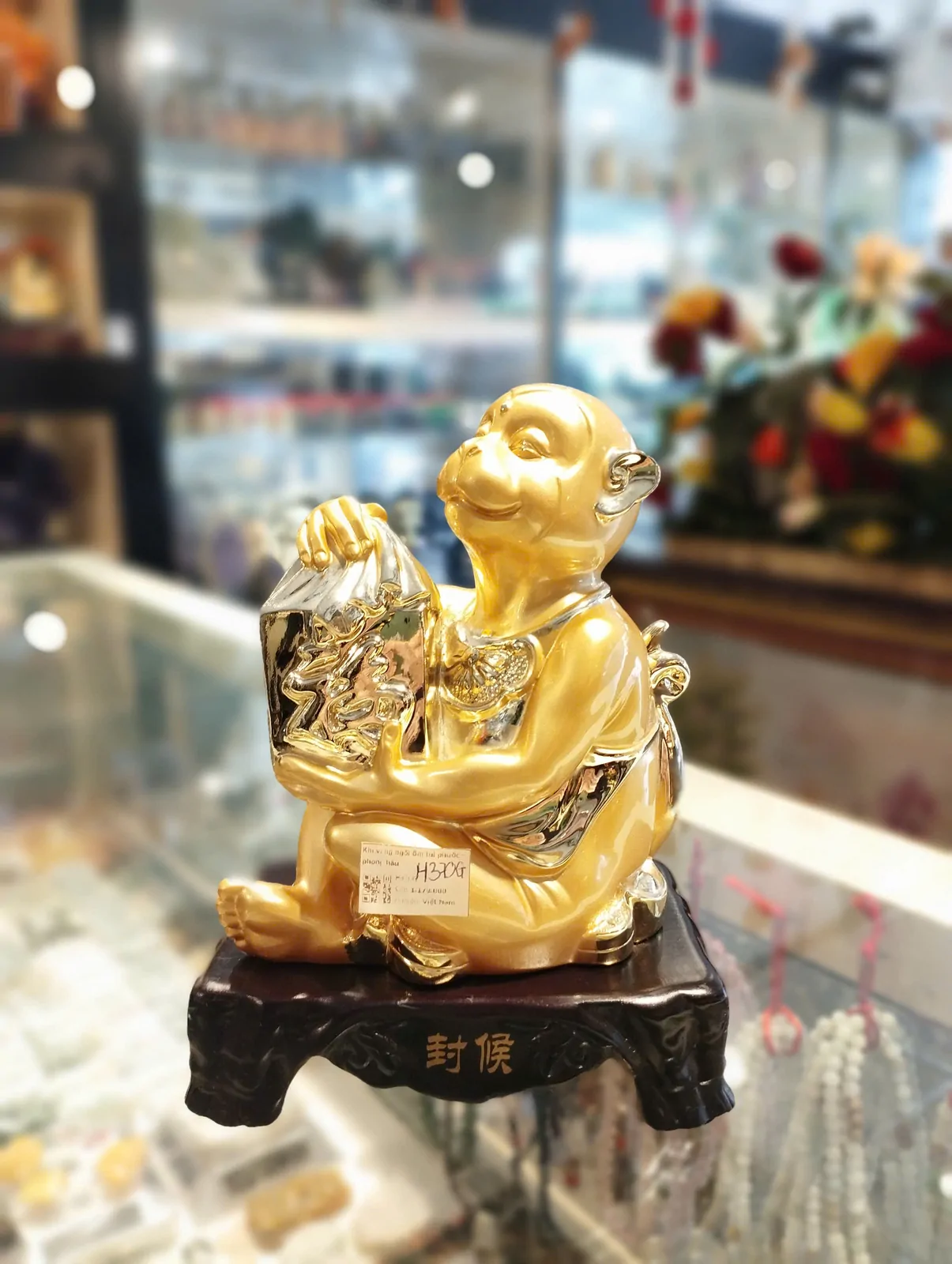 Khỉ vàng ngồi ôm túi phước - phong hầu H370G